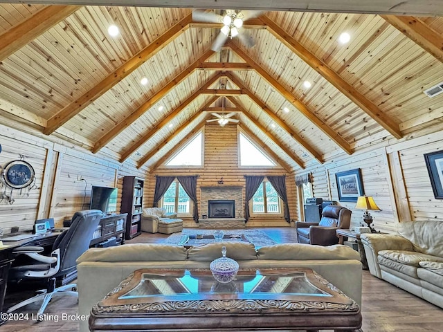 living room with wooden ceiling, wood finished floors, a fireplace, high vaulted ceiling, and beam ceiling