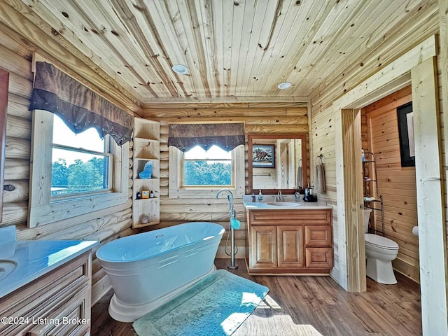 full bath with wooden ceiling, toilet, wood finished floors, vanity, and a healthy amount of sunlight