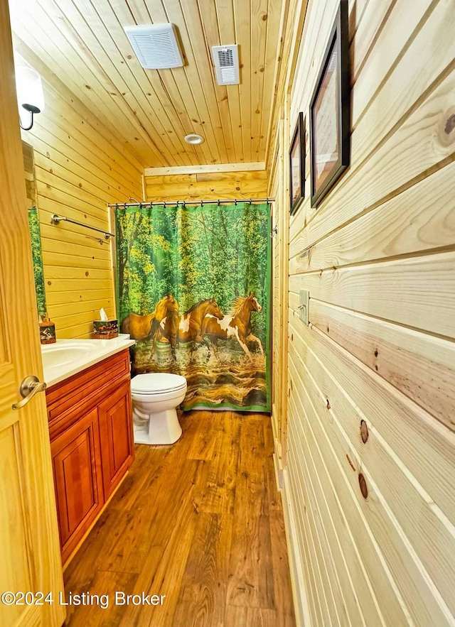 full bathroom featuring visible vents, toilet, wood ceiling, wood finished floors, and vanity