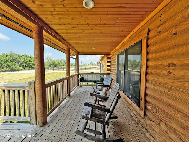 wooden terrace featuring a porch