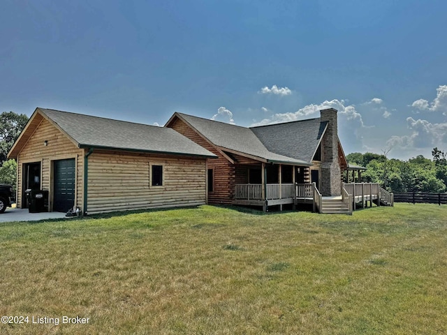 view of property exterior with a shingled roof, a chimney, fence, and a lawn