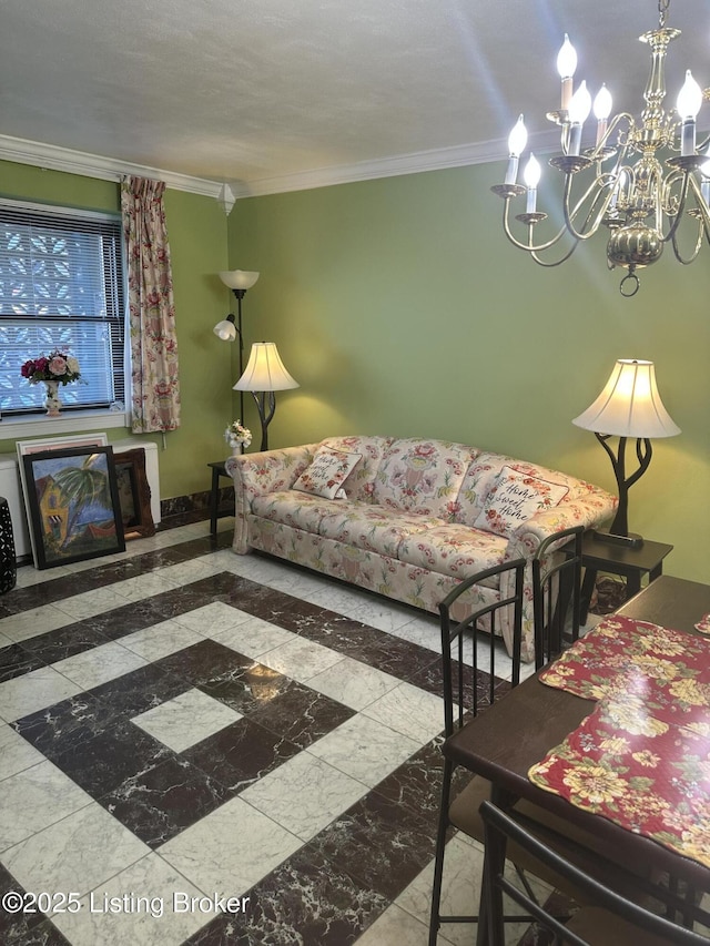 living room with baseboards, an inviting chandelier, and ornamental molding