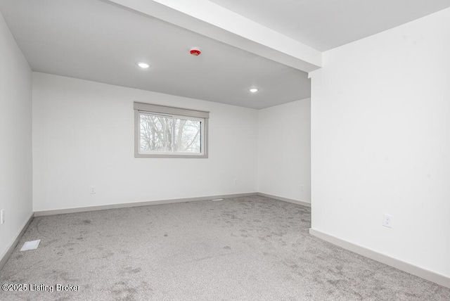 carpeted spare room featuring recessed lighting and baseboards