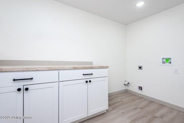 laundry area with electric dryer hookup, washer hookup, light wood-style flooring, baseboards, and gas dryer hookup