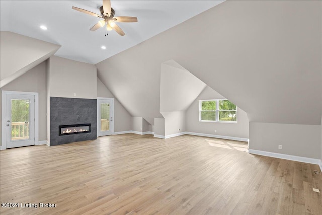 bonus room featuring lofted ceiling, light wood finished floors, and baseboards