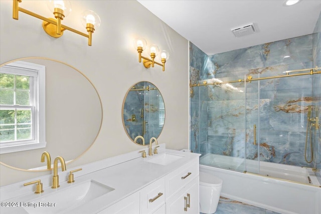 full bathroom featuring toilet, visible vents, bath / shower combo with glass door, and a sink