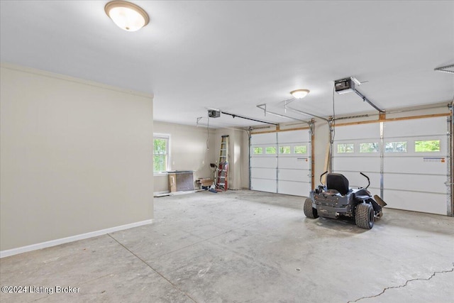 garage featuring baseboards and a garage door opener