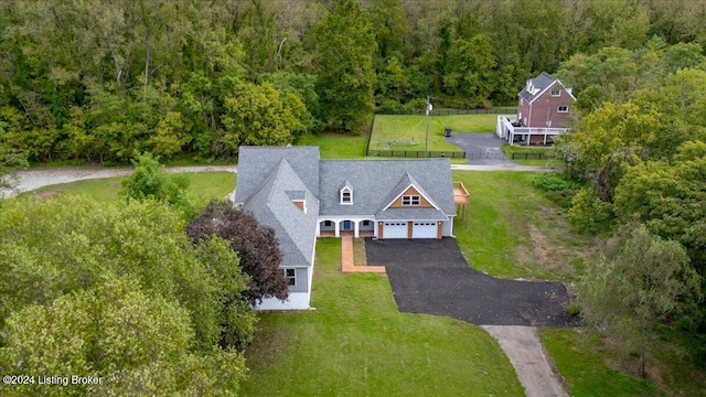 drone / aerial view with a view of trees