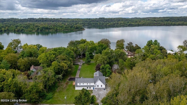 drone / aerial view featuring a water view and a view of trees