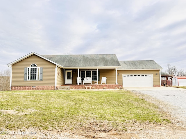 ranch-style house featuring a front yard, driveway, covered porch, a garage, and crawl space