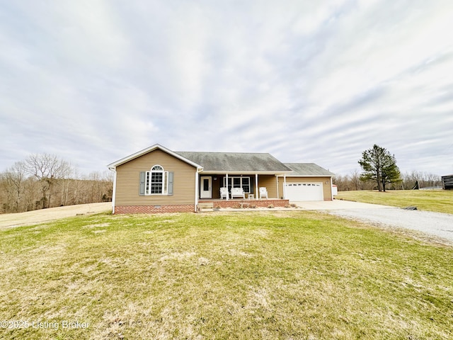 ranch-style house with a porch, a garage, driveway, and a front yard