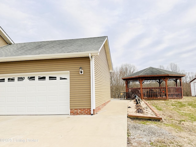 garage with concrete driveway