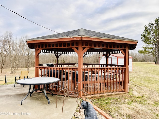 surrounding community with a gazebo and a yard