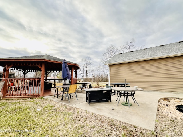 view of patio / terrace with a gazebo and a fire pit