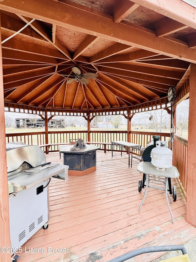 deck with a gazebo, a grill, and an outdoor fire pit