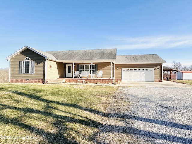 ranch-style house with a garage, a porch, gravel driveway, a front yard, and crawl space