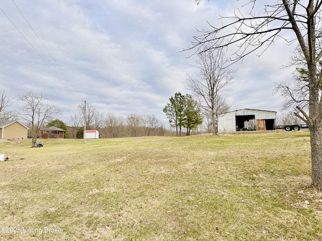 view of yard with an outbuilding and a garage