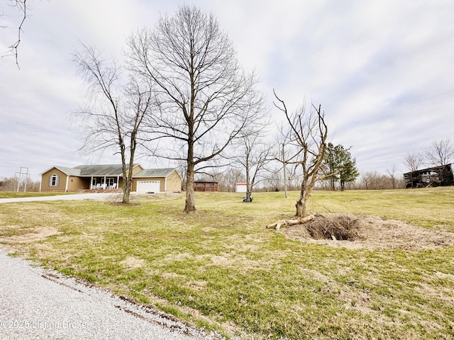 view of yard with a garage