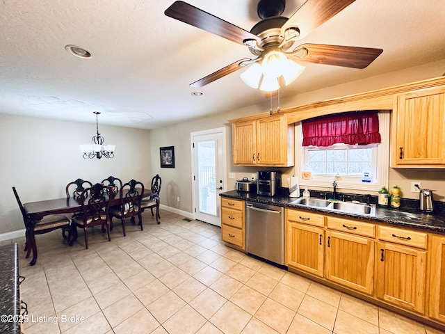 kitchen with dishwasher, light tile patterned floors, baseboards, and a sink