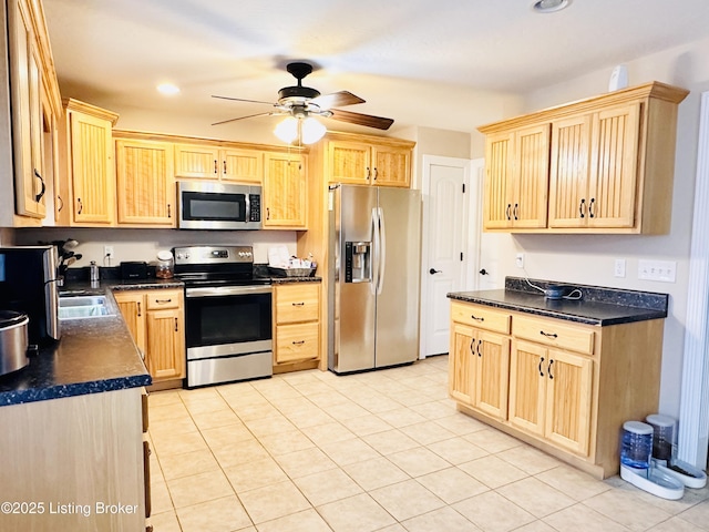 kitchen featuring dark countertops, ceiling fan, light brown cabinetry, recessed lighting, and appliances with stainless steel finishes