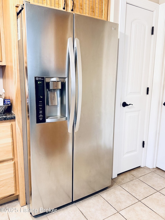 interior space with stainless steel fridge with ice dispenser