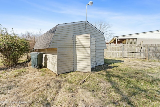 view of shed with fence