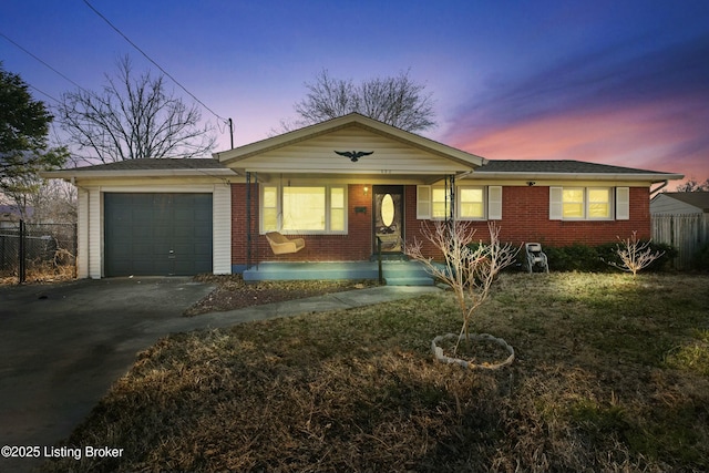 single story home featuring a garage, a porch, fence, and aphalt driveway