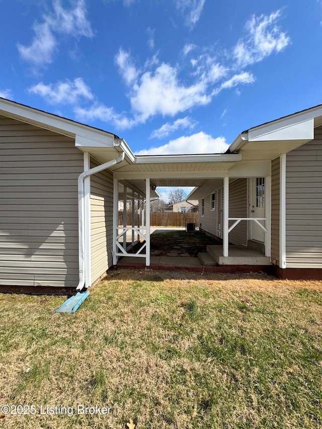 view of yard featuring fence and a patio