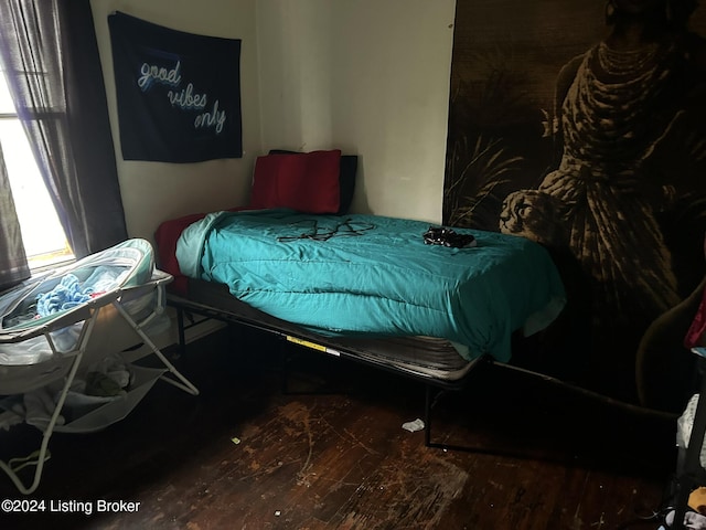 bedroom with wood finished floors