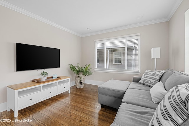 living room with dark wood-type flooring, baseboards, and crown molding