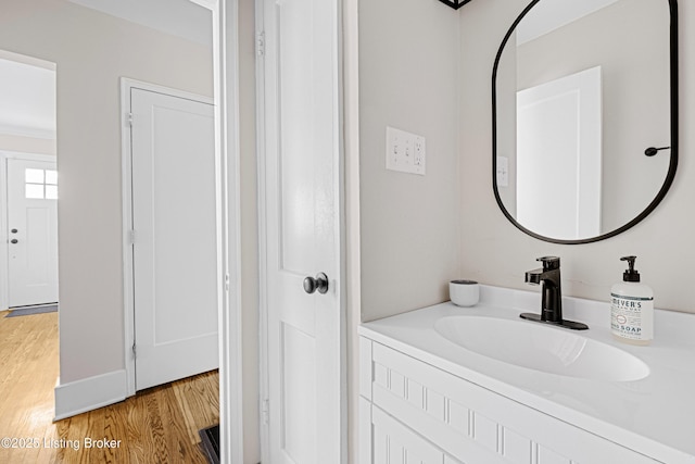 bathroom featuring wood finished floors and vanity
