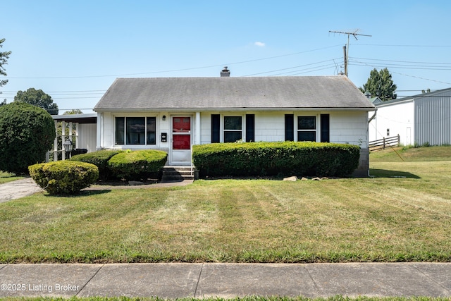 view of front of property with entry steps, a chimney, fence, and a front lawn