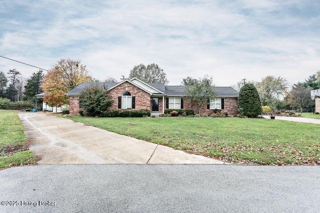 single story home featuring a front yard, concrete driveway, and brick siding