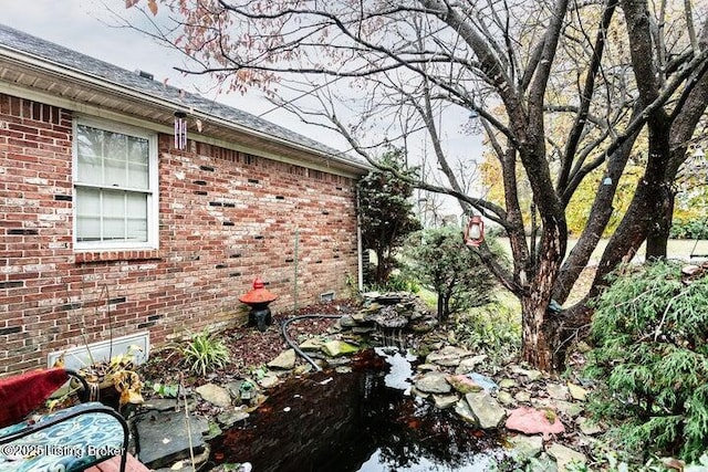 view of side of home featuring brick siding