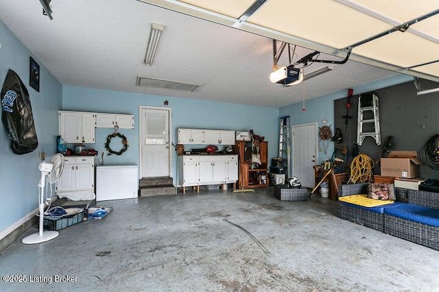 garage featuring a garage door opener