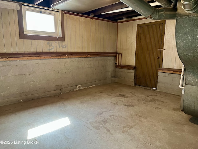 basement featuring concrete block wall