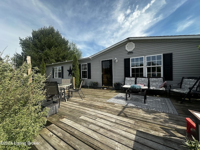 wooden deck with outdoor dining area