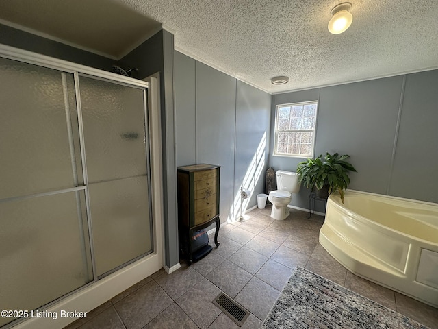 bathroom featuring visible vents, a decorative wall, a shower stall, and toilet