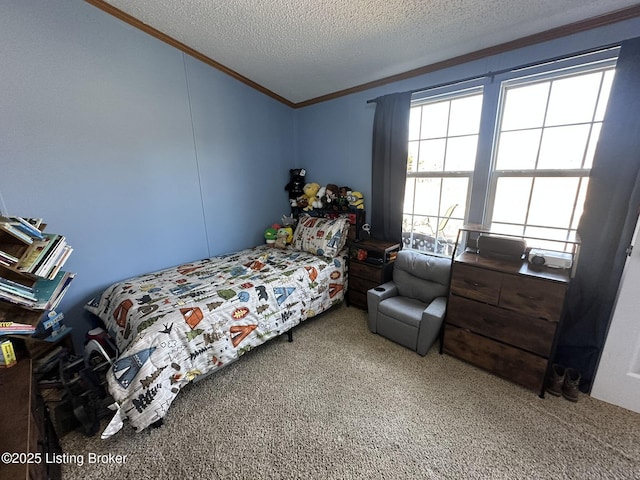 bedroom featuring ornamental molding, a textured ceiling, and carpet flooring