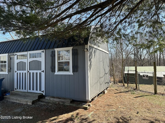 view of shed with fence