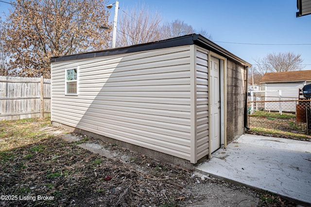 view of outbuilding with an outdoor structure and a fenced backyard