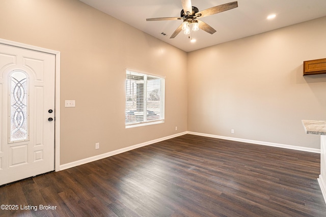 entryway featuring dark wood finished floors, a ceiling fan, and baseboards