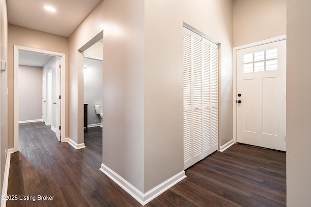 entrance foyer with baseboards and dark wood-style flooring