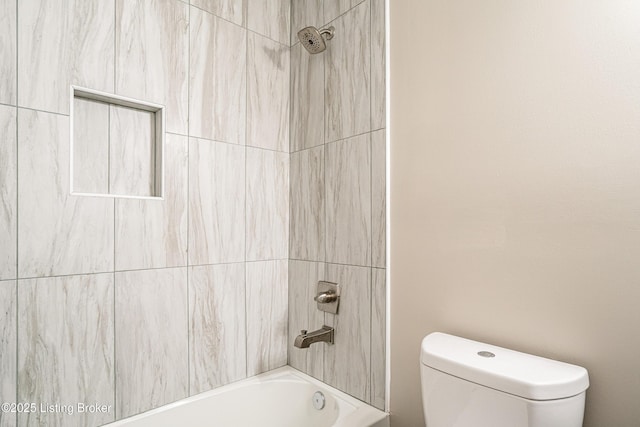 bathroom with shower / washtub combination and toilet