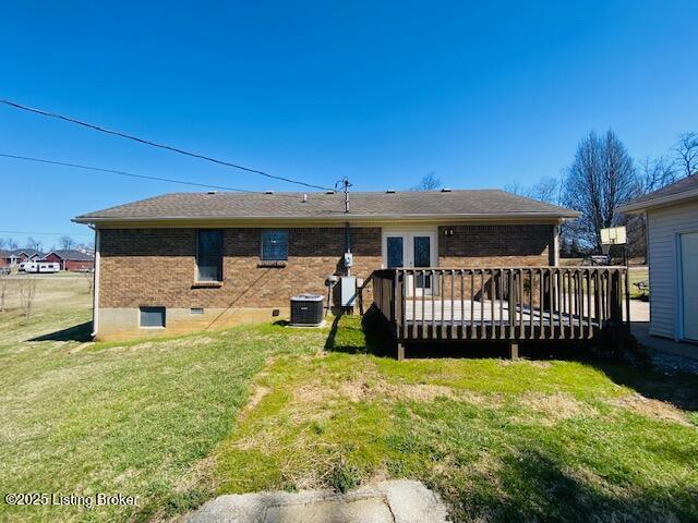 back of house featuring a deck, a yard, central AC unit, and brick siding