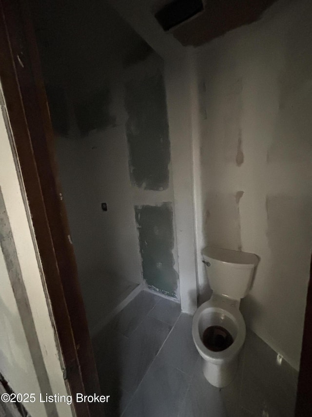 bathroom featuring tile patterned floors and toilet