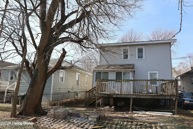 back of house with a deck and stairway