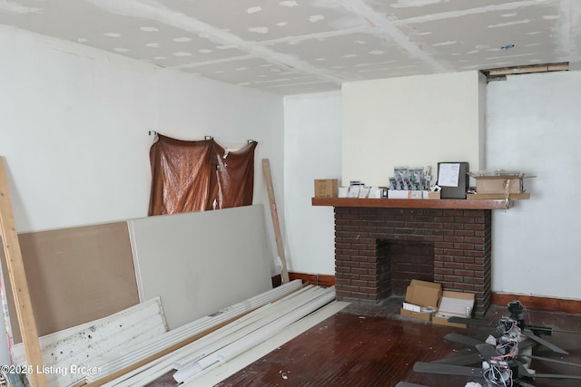 interior space with wood finished floors and a fireplace