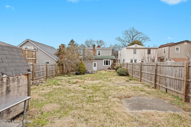 view of yard with a fenced backyard