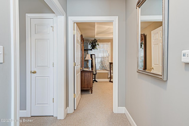 corridor with baseboards and carpet floors